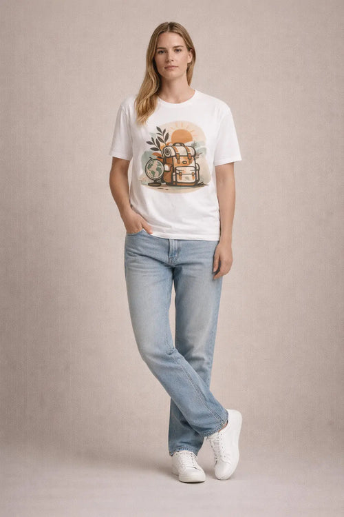 Female model wearing a Printify Adventure Backpack T-Shirt featuring a travel globe graphic design.